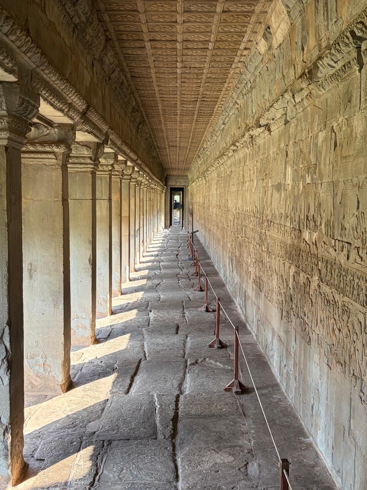 Carved stone corridor inside Angkor Wat
