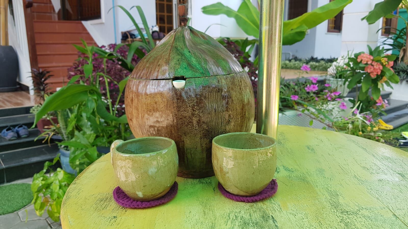 Coconut shell drink with handmade ceramic cups