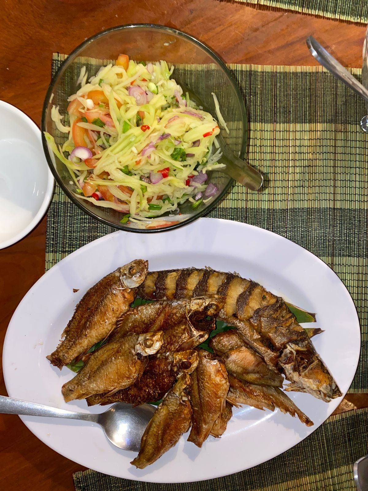 Fried fish with green mango salad