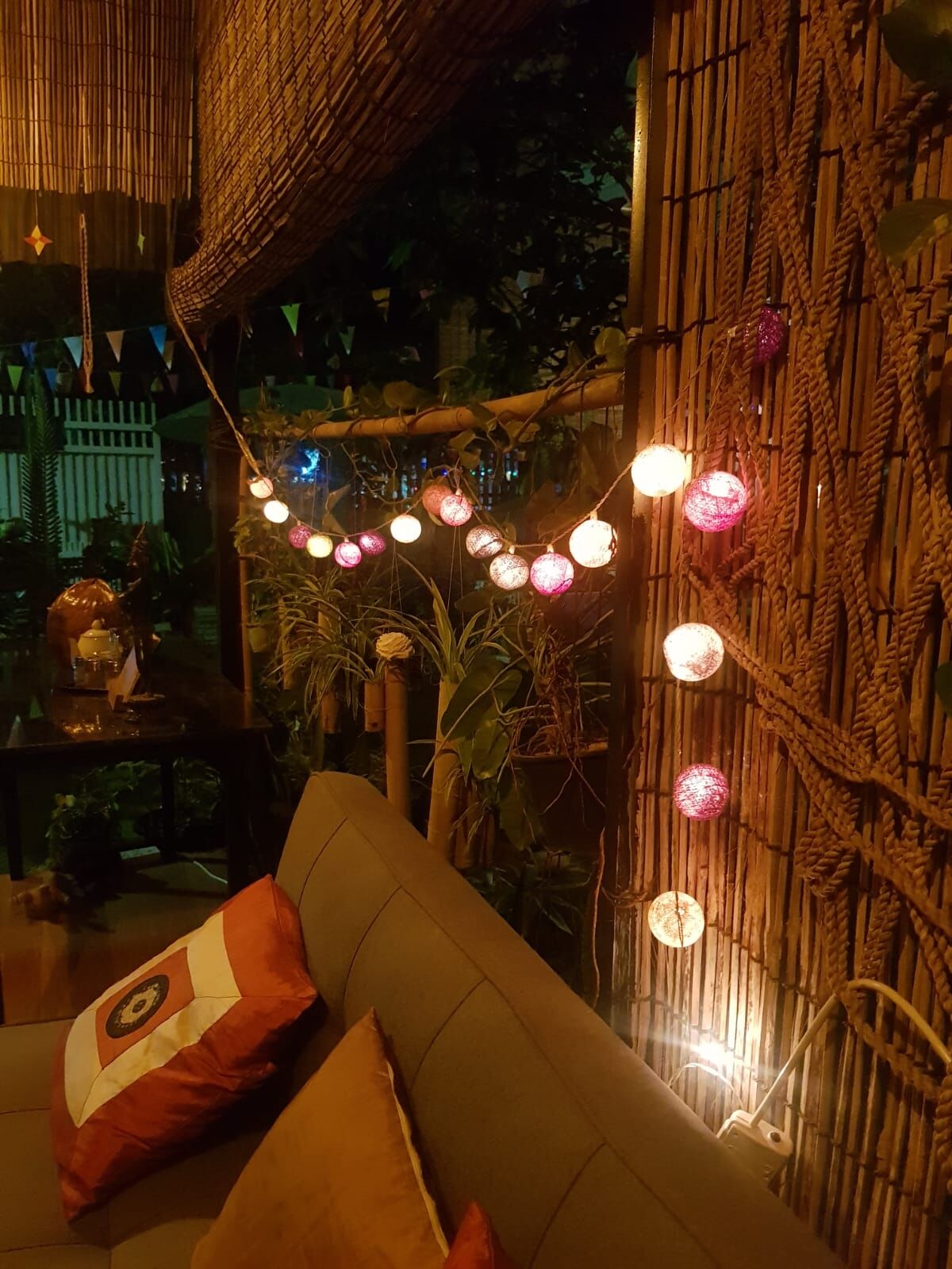 Flowers and a carved coconut shell in the garden